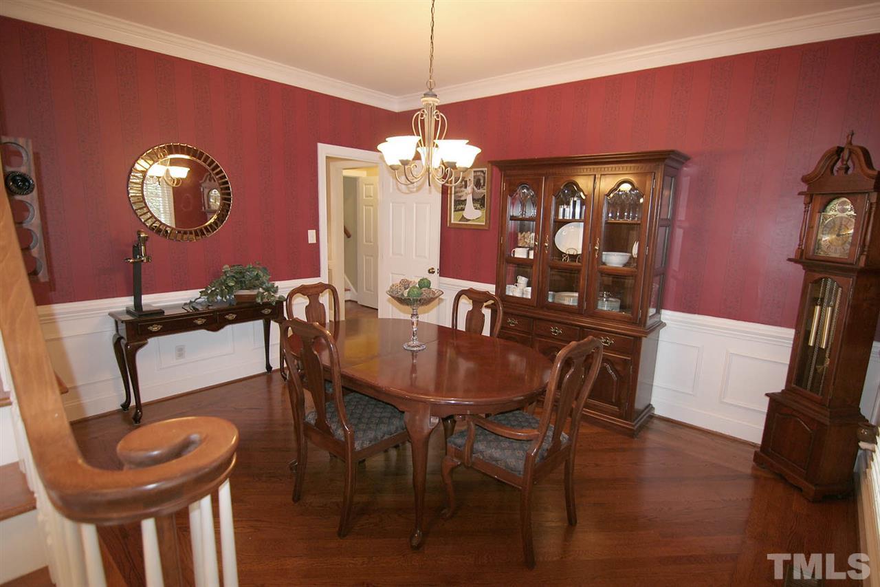 7903 Laurel Mountain Road Raleigh, NC 27613 - Photo 11 of 25 Dining Room showcases the Timeless Design of Picture Frame Hardwood Floor Trim around Diagonally Installed Hardwood Floors + Crown Molding, Chairrail & Wainscoting. THE Perfect Place to Entertain Family and Friends