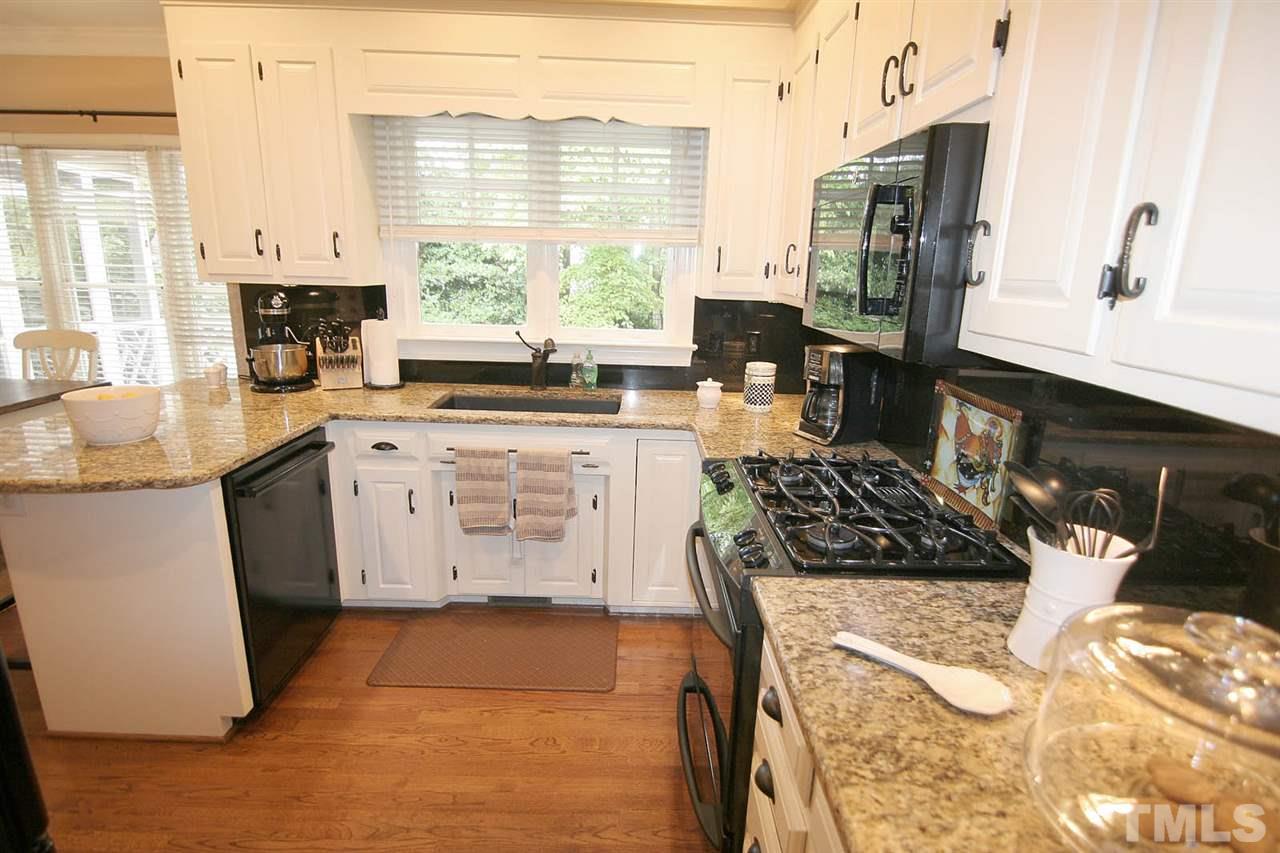 7903 Laurel Mountain Road Raleigh, NC 27613 - Photo 14 of 25 Kitchen showcases Stainless Steel Appliances + Gas Stove, Extra Deep & Extra Large Sink