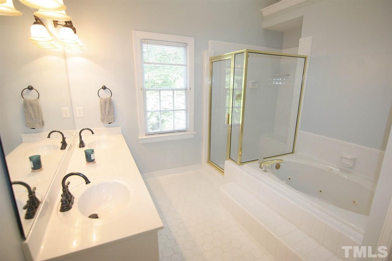 7903 Laurel Mountain Road Raleigh, NC 27613 - Photo 17 of 25 What's Not to Love??? ... Spacious Master Bath complete with Vaulted Ceiling, Whirlpool Tub, Separate Shower and a Double, Mirrored Vanity with Double Sinks