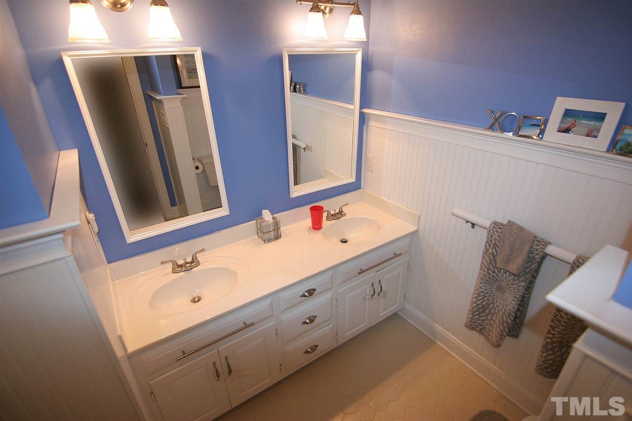 7903 Laurel Mountain Road Raleigh, NC 27613 - Photo 21 of 25 Hall Bathroom with Pizazz ... Tongue 'n Groove Paneling on Walls and Double, Mirrored Vanity with Double Sinks
