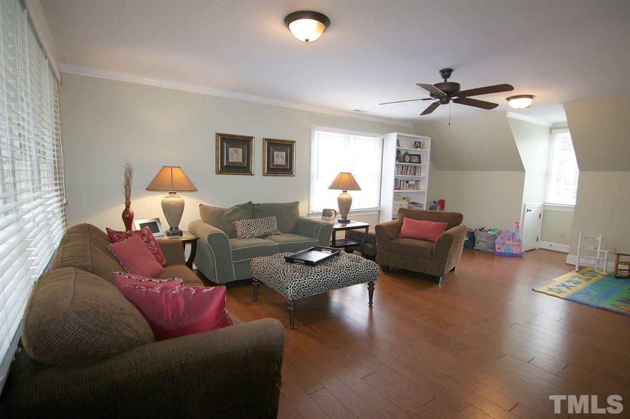 7903 Laurel Mountain Road Raleigh, NC 27613 - Photo 22 of 25 This Bonus has some Serious Room to Play!!! It is complete with Hardwood Floors & Crown Molding.