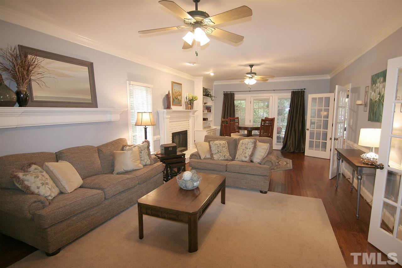 7903 Laurel Mountain Road Raleigh, NC 27613 - Photo 7 of 25 Embrace this Generously Sized Great Room complete with French Doors that can Separate it from the Kitchen and/or Foyer.