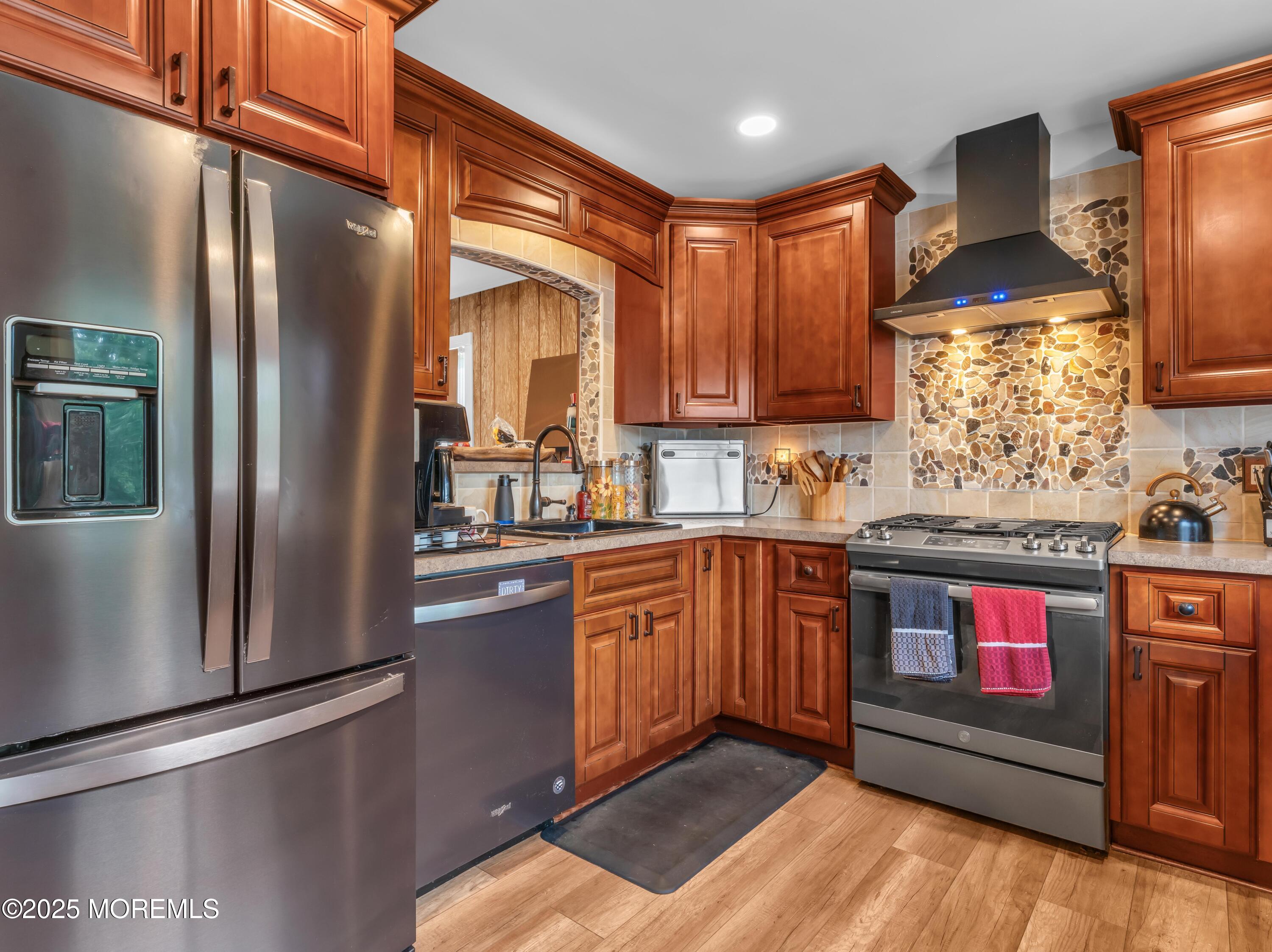 1 Andover Road Jackson, NJ 08527 - Photo 3 of 32 a kitchen with stainless steel appliances granite countertop a refrigerator a stove and a sink