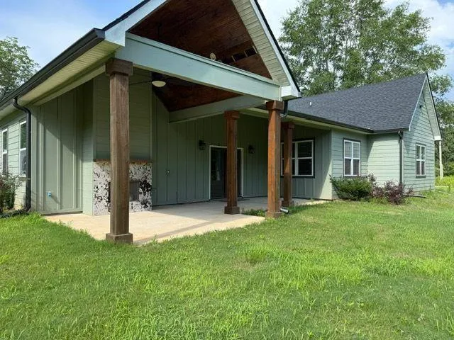 a view of a house with brick walls