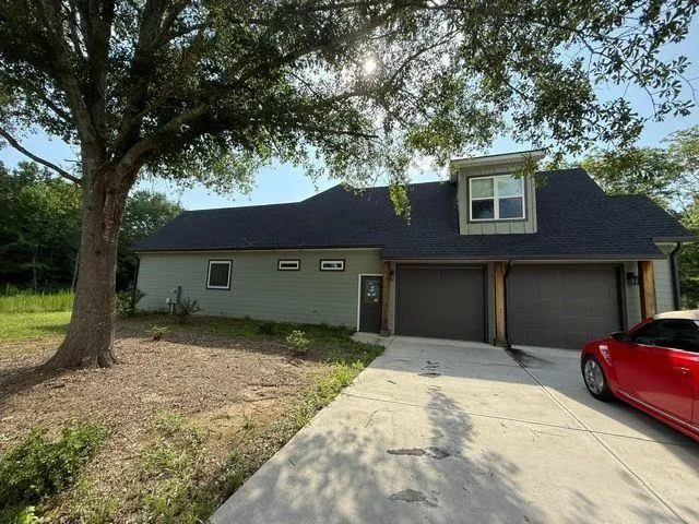 a house view with a backyard space