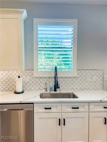 a living room with couches and a flat screen tv