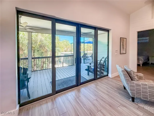 a bedroom with a bed and a ceiling fan