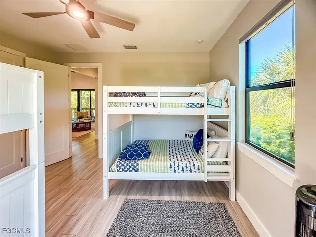 a bathroom with double vanity sinks and a mirror