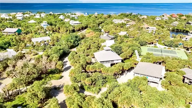 a view of a lake with a houses with swimming pool