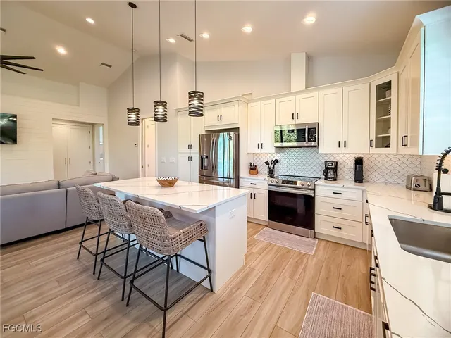 a view of a lake with outdoor seating