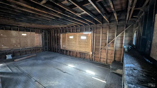 a view of room with wooden floor