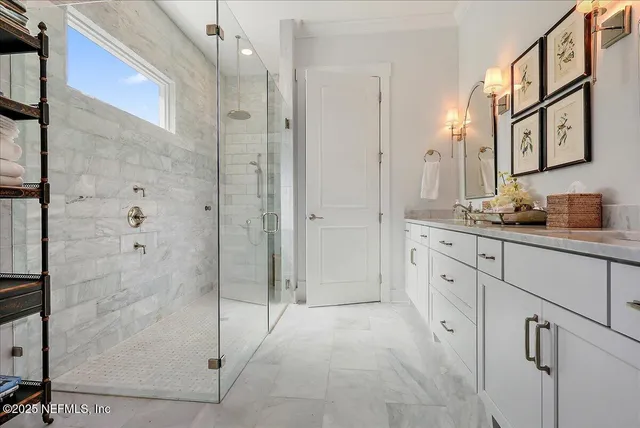 a spacious bathroom with a shower and a sink