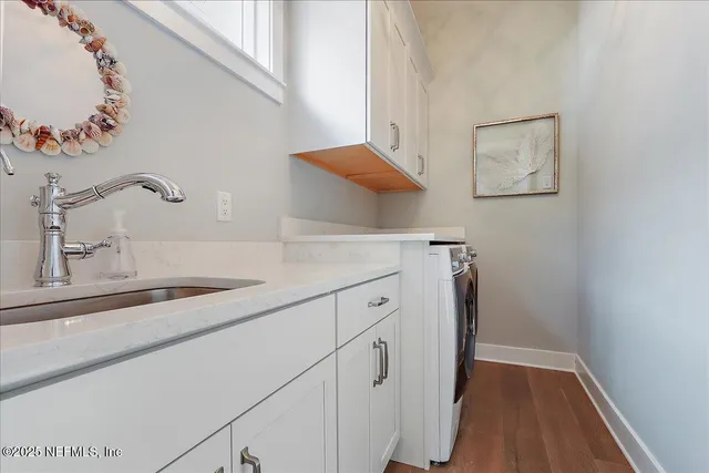 a view of a kitchen cabinets and a sink