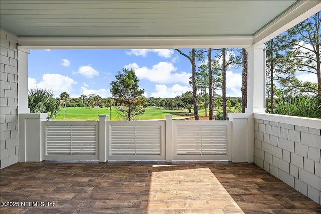 a view of balcony with furniture
