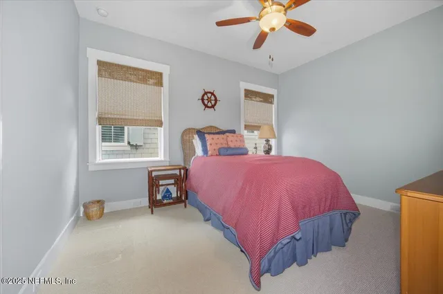 a bed room with a bed and a chandelier