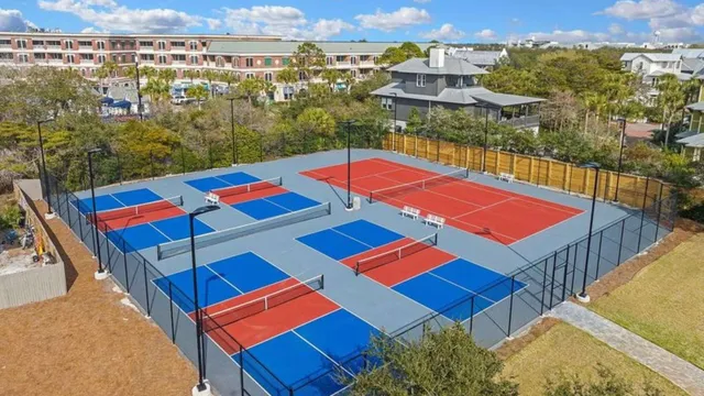 an aerial view of a house with a yard and garden
