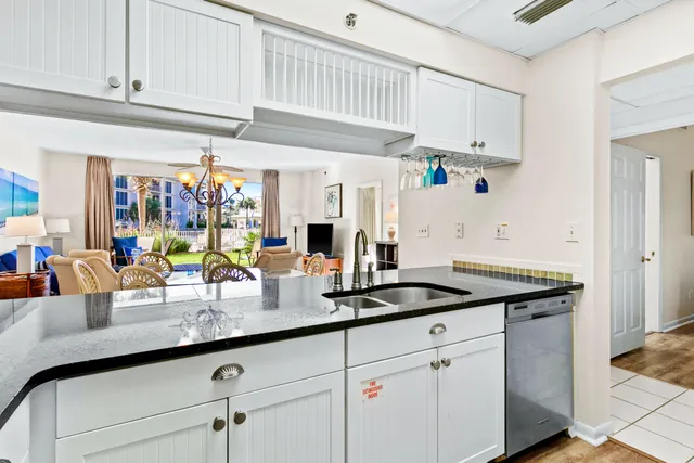 a kitchen with stainless steel appliances granite countertop a sink and cabinets