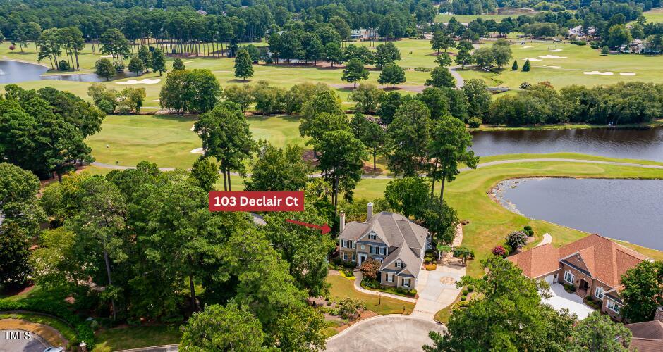 an aerial view of residential house with outdoor space and swimming pool