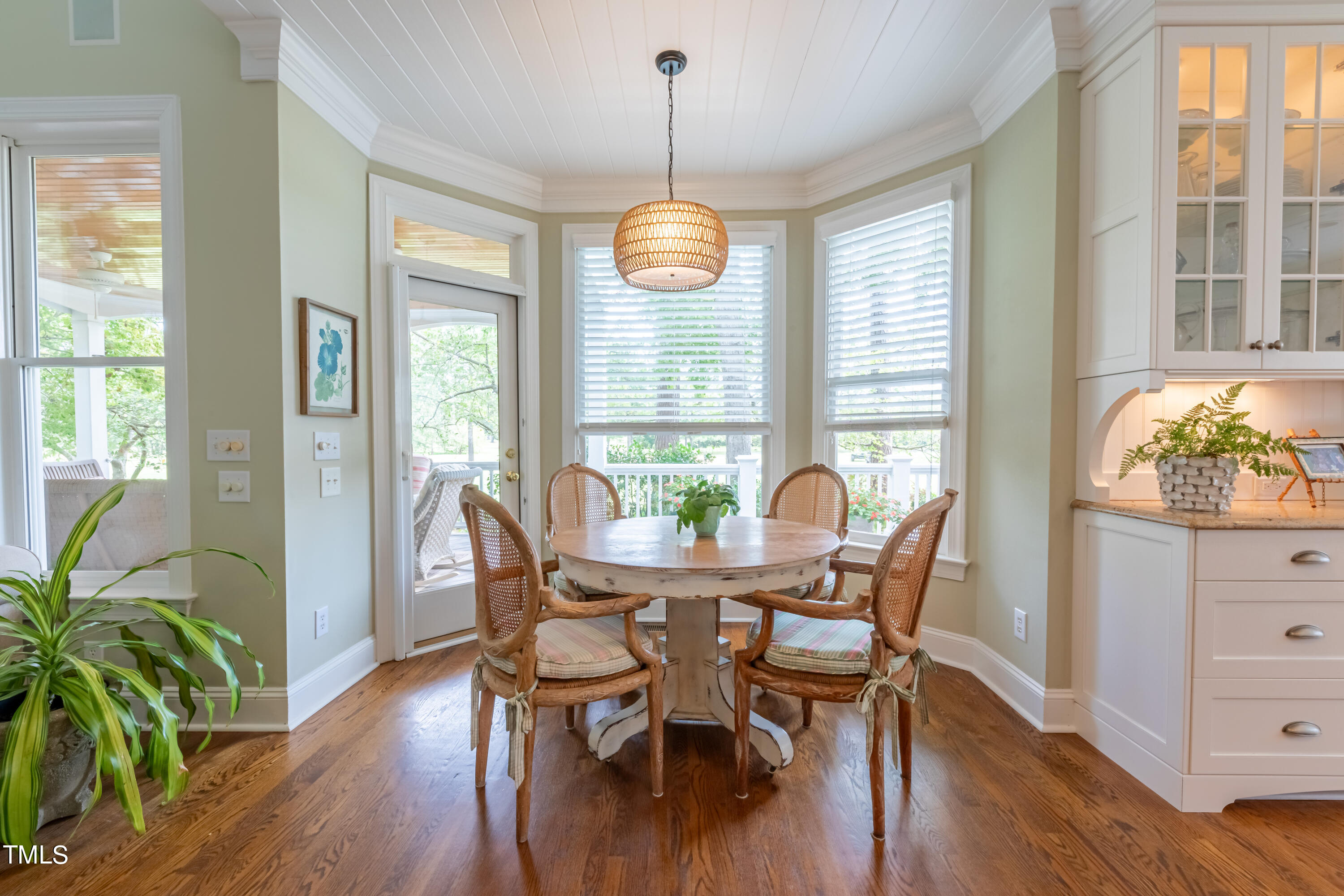 103 Declair Court Cary, NC 27513 - Photo 12 of 47 a dining room with furniture a chandelier and wooden floor