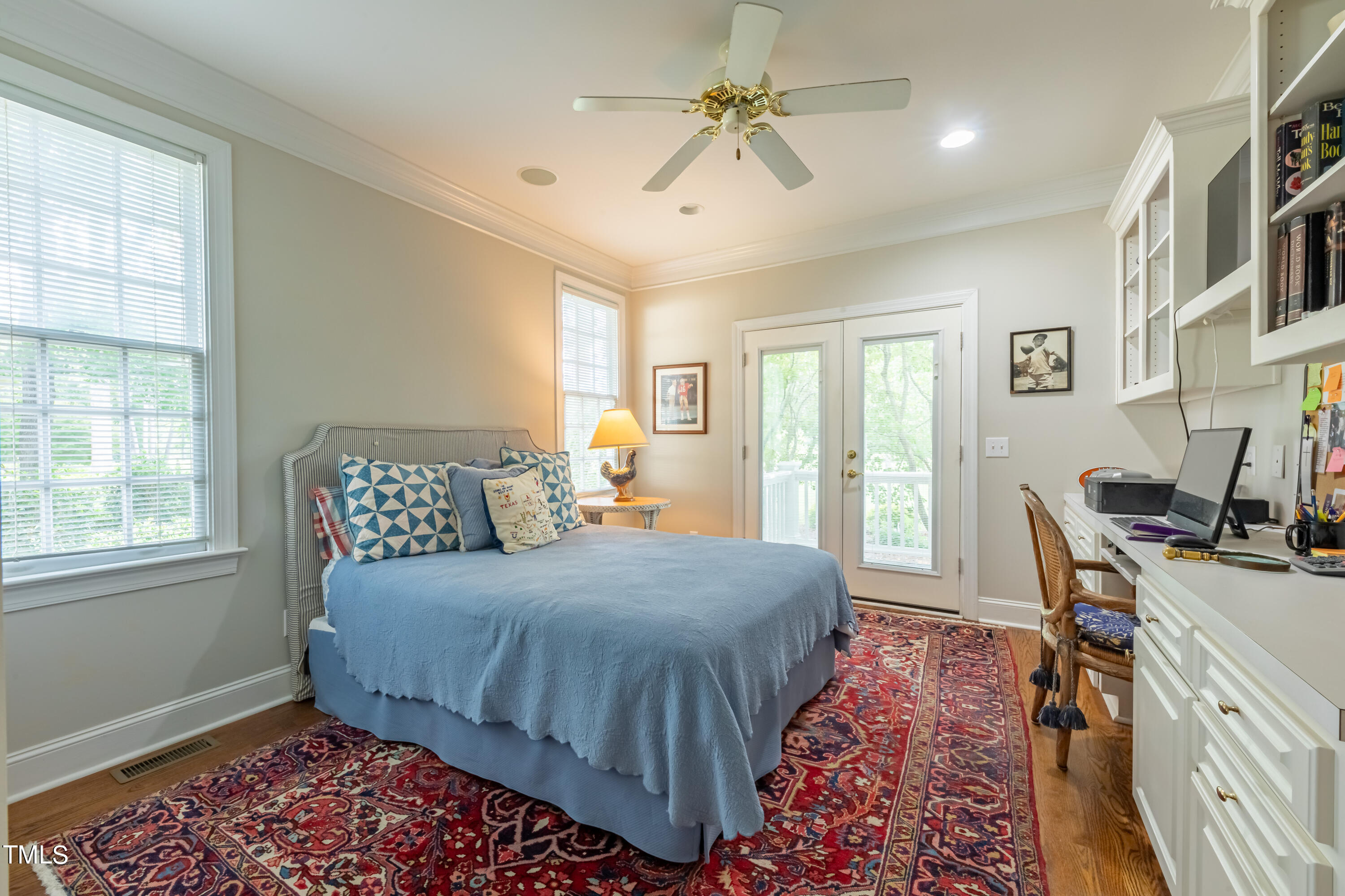 103 Declair Court Cary, NC 27513 - Photo 23 of 47 a bedroom with a bed a table and a chandelier