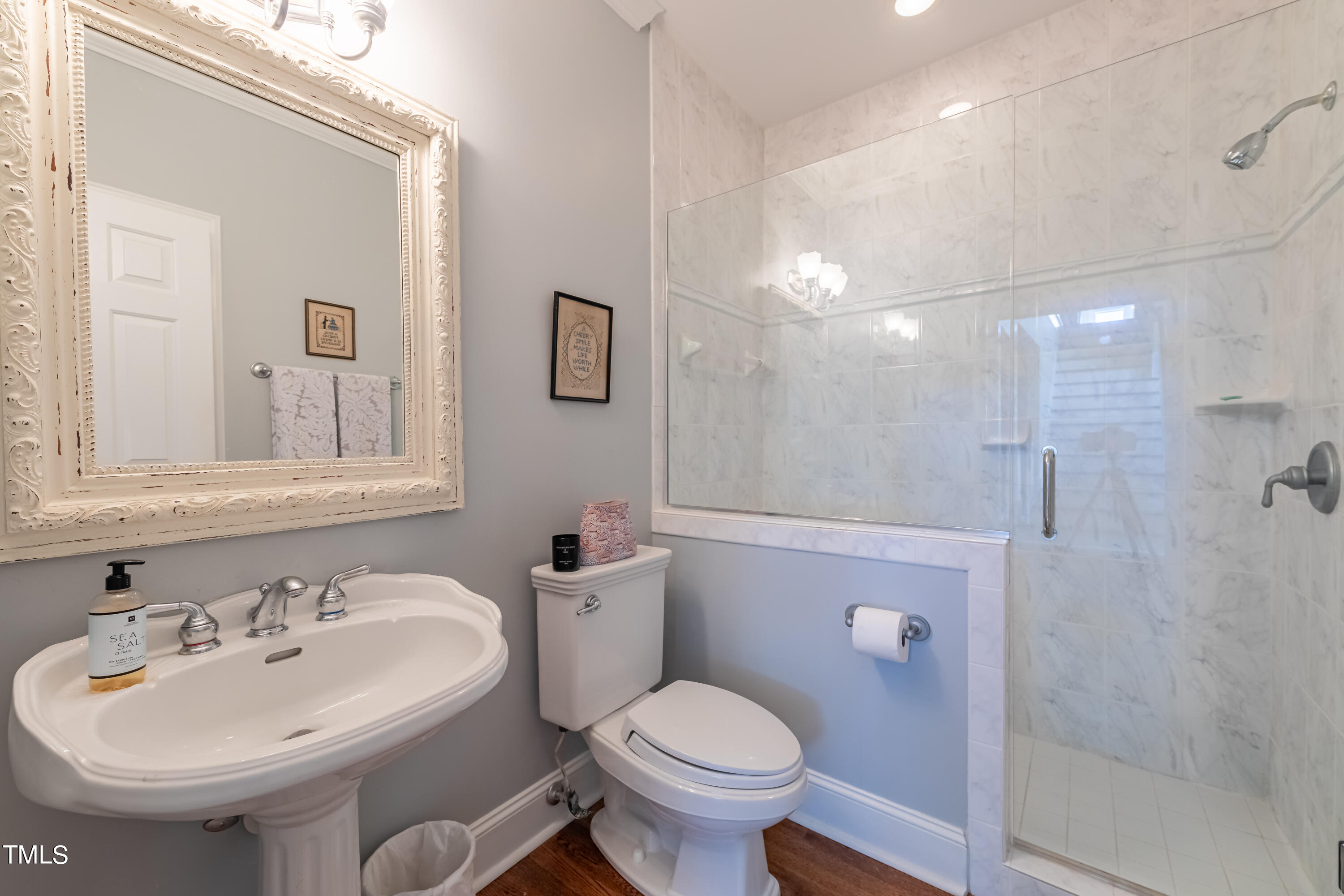 103 Declair Court Cary, NC 27513 - Photo 24 of 47 a bathroom with a sink toilet and shower