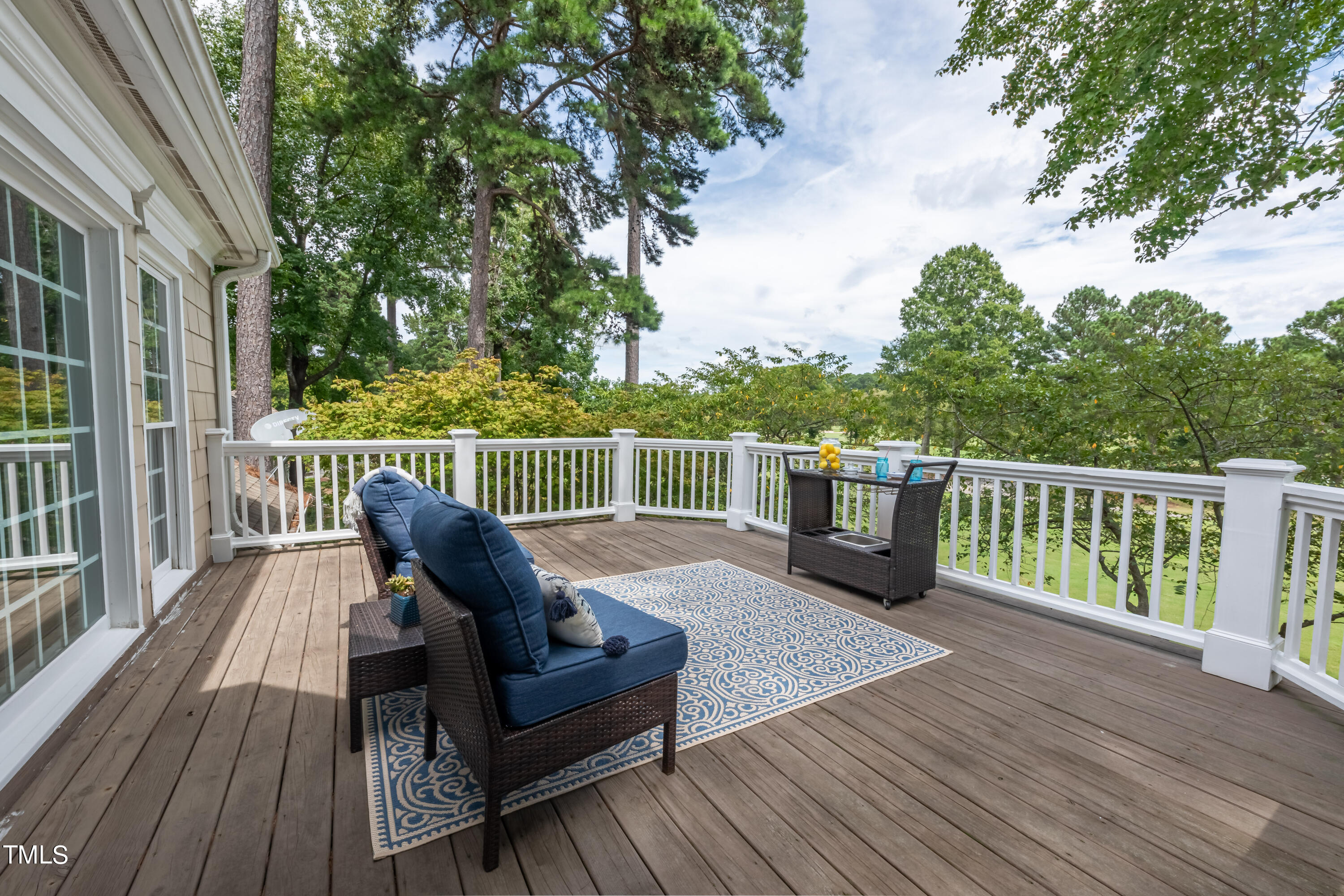 103 Declair Court Cary, NC 27513 - Photo 28 of 47 a view of a deck with two chairs and wooden floor