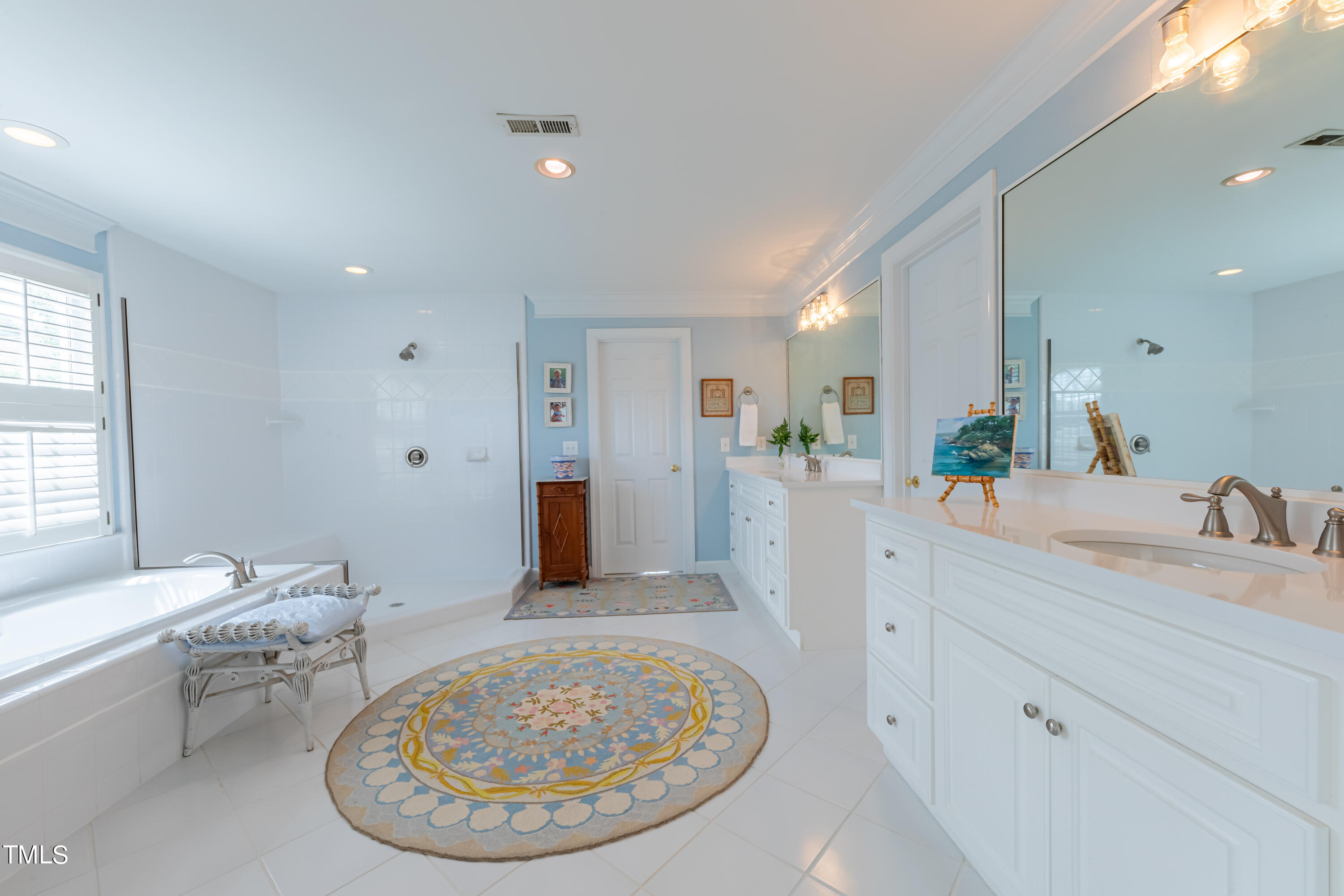 103 Declair Court Cary, NC 27513 - Photo 35 of 47 a view of a kitchen with kitchen island a sink granite counter tops and a window