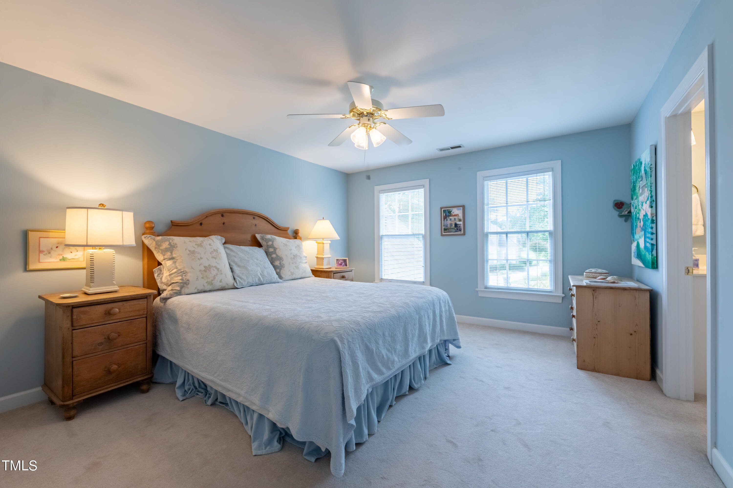 103 Declair Court Cary, NC 27513 - Photo 37 of 47 a bedroom with a bed and a chandelier