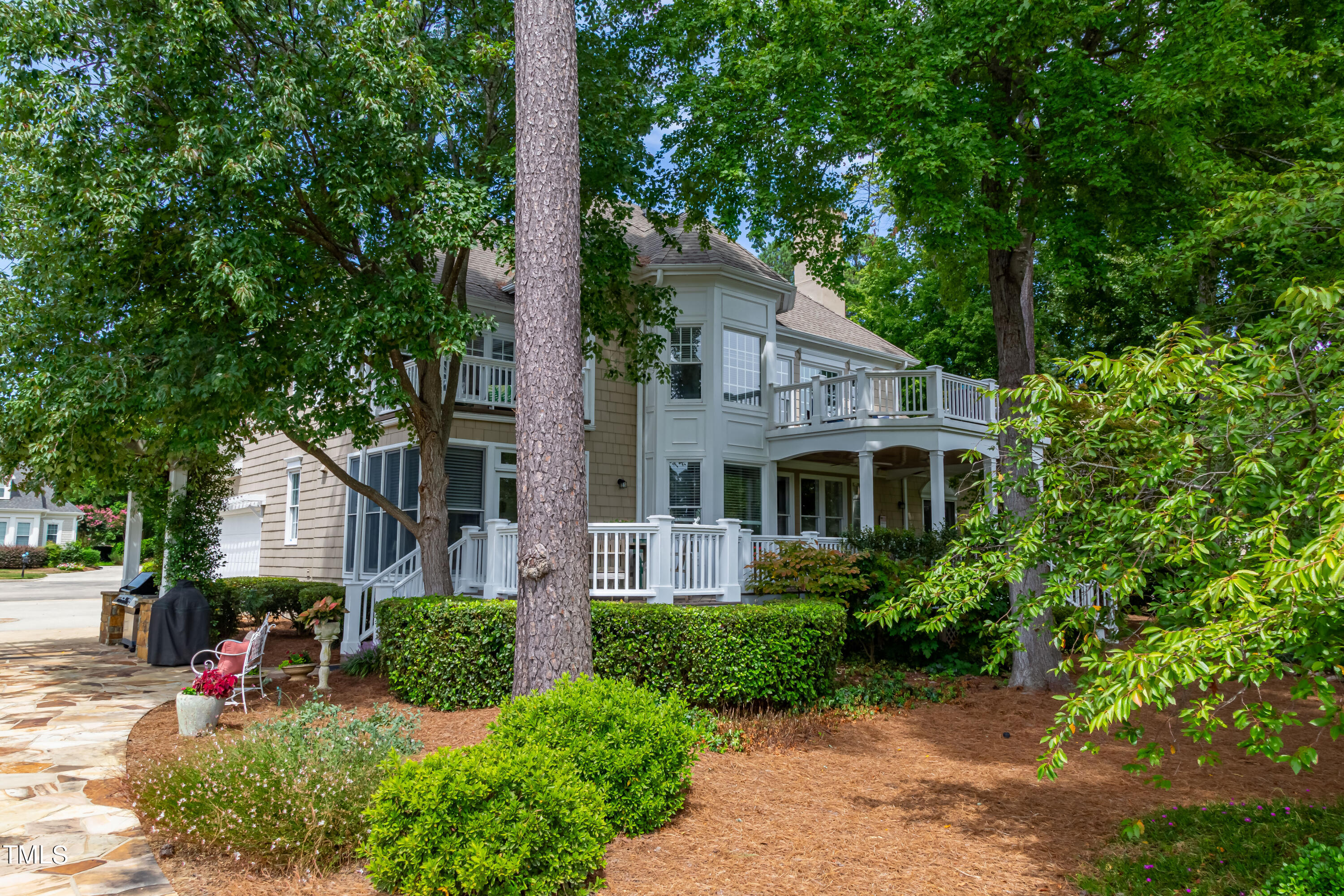 103 Declair Court Cary, NC 27513 - Photo 4 of 47 a front view of a house with a yard and potted plants