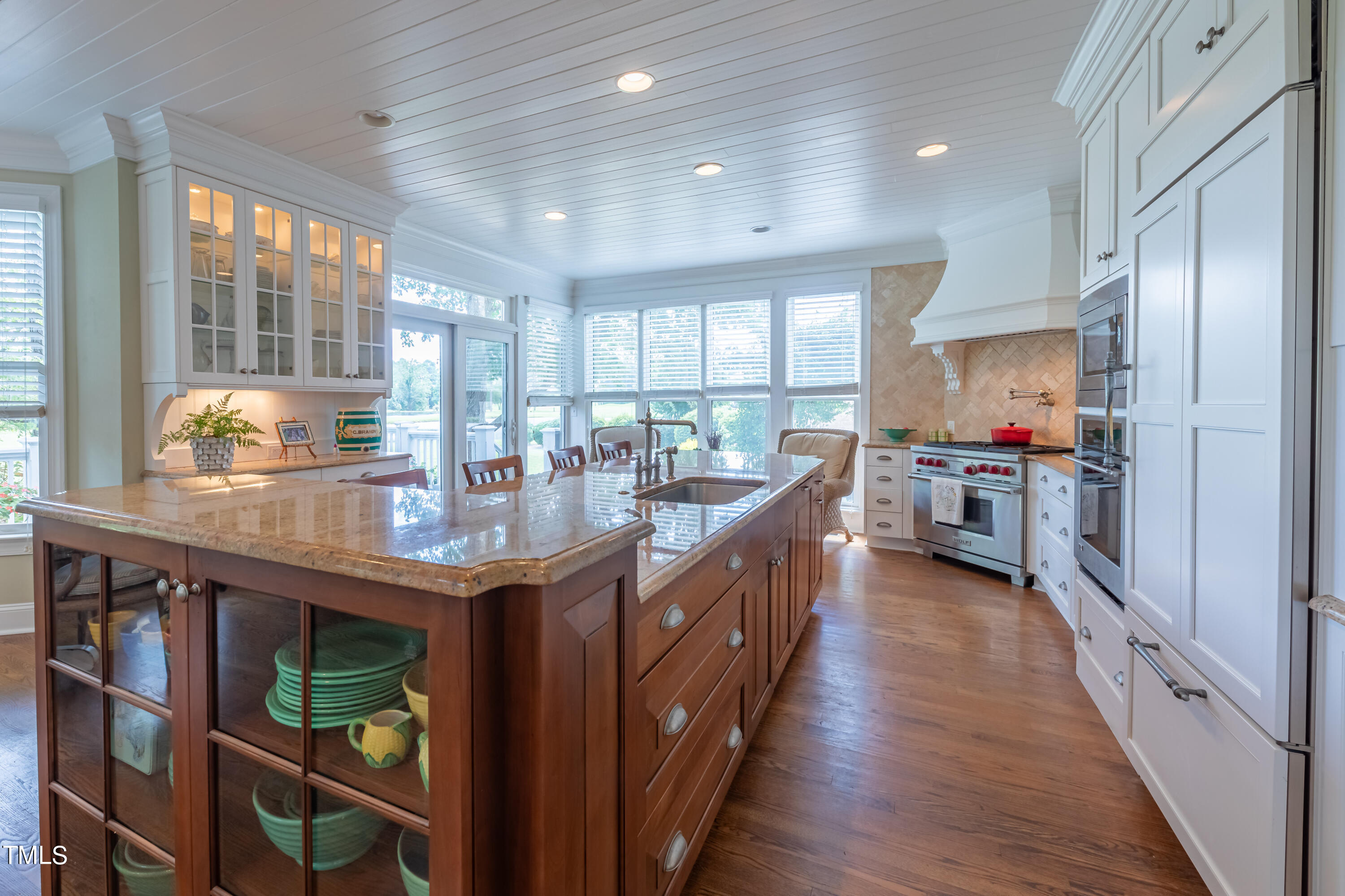 103 Declair Court Cary, NC 27513 - Photo 9 of 47 a kitchen with stainless steel appliances granite countertop counter space wooden floor and window