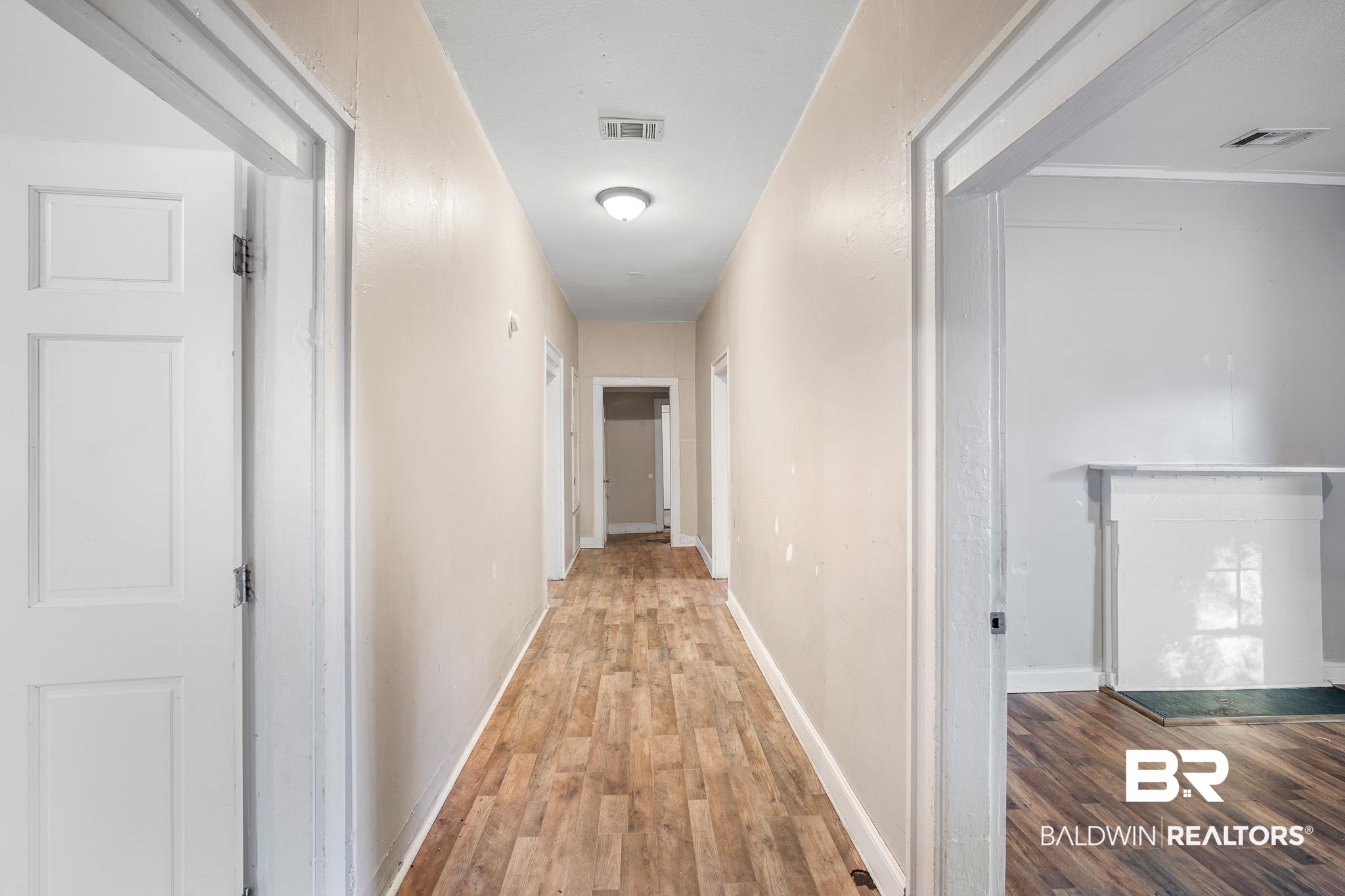 401 Gaston Street Mobile, AL 36603 - Photo 3 of 17 Hallway featuring hardwood / wood-style floors