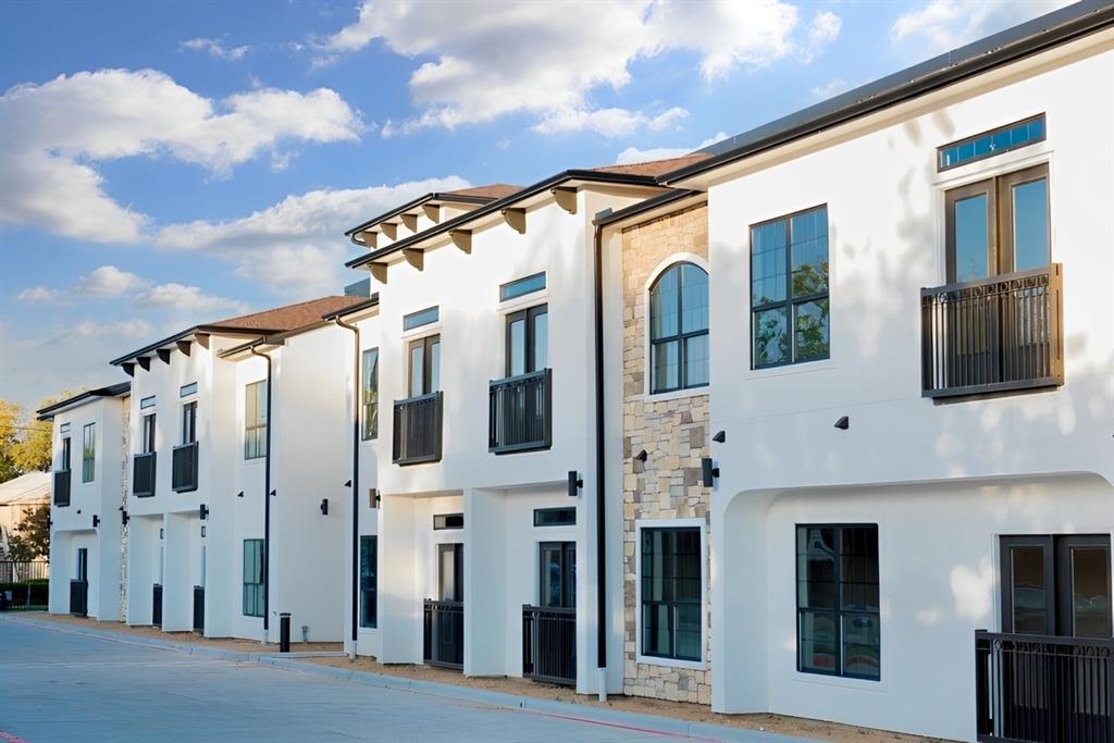 1514 East 15th Street, Unit 19 Plano, TX 75074 - Photo 1 of 1 a front view of a building with grey walls