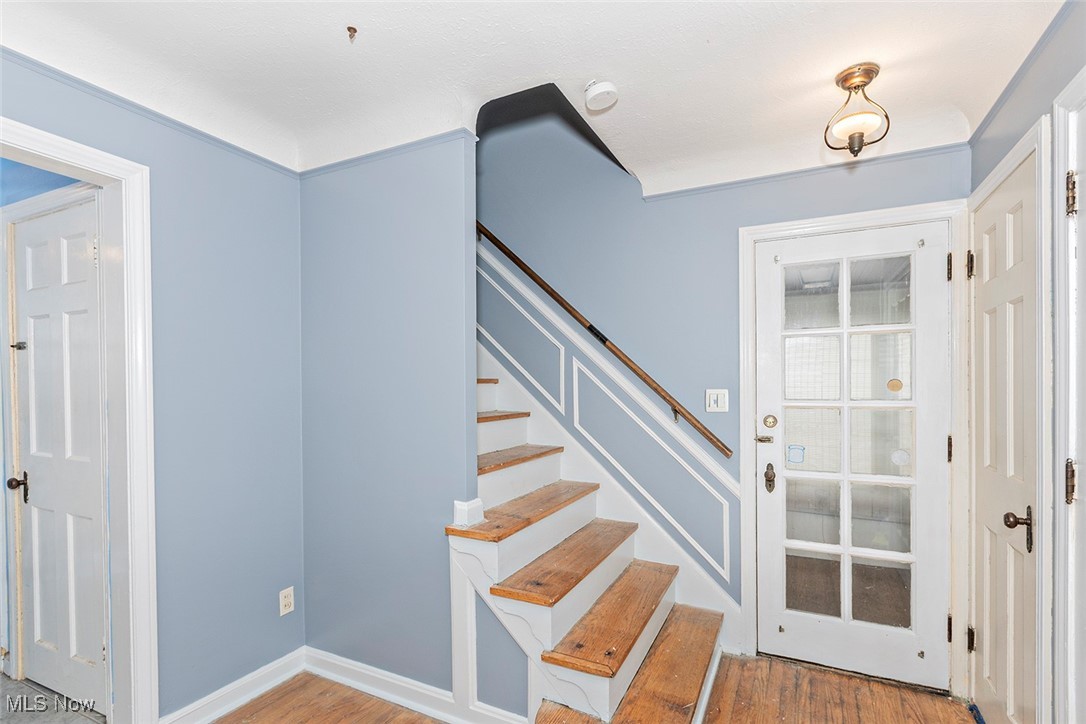 3719 Berkeley Road Cleveland Heights, OH 44118 - Photo 25 of 44 Stairway with wood finished floors and baseboards