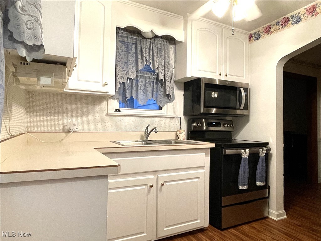 1430 Belrose Road Cleveland, OH 44124 - Photo 5 of 27 White cabinetry with stainless steel appliances