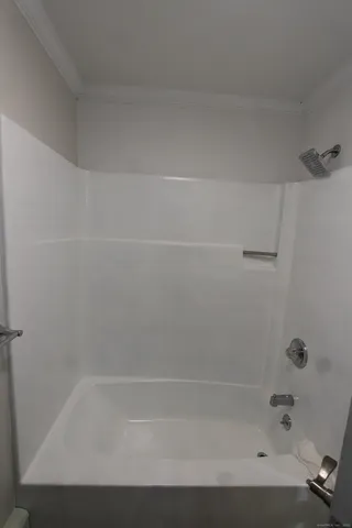 a close up of a bathtub in a bathroom