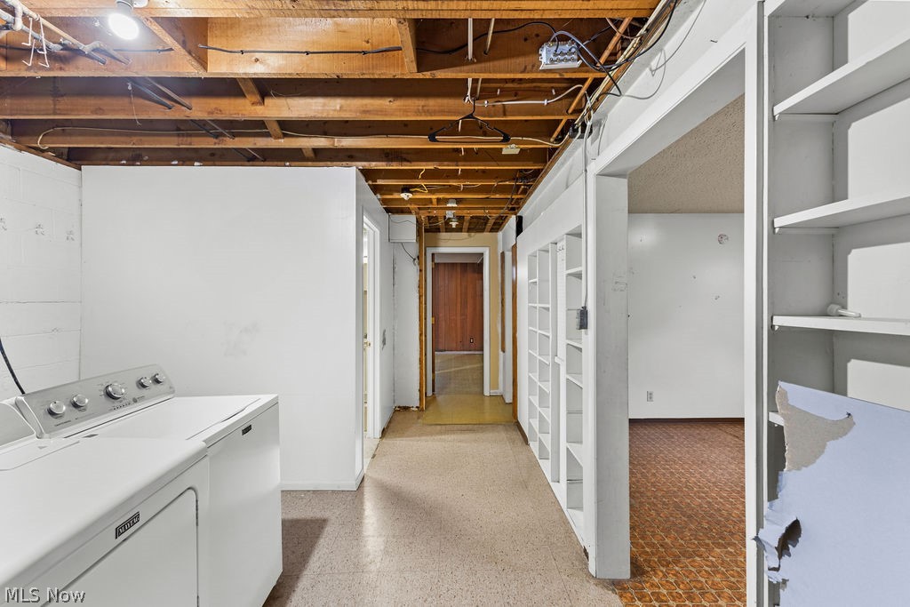 1903 Graham Road Stow, OH 44224 - Photo 20 of 29 Laundry area featuring a top-load washing machine, exposed ceiling joists, and built-in shelving units