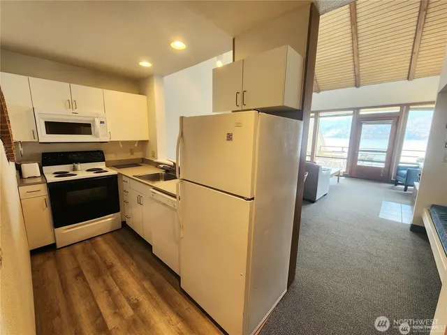 a white refrigerator freezer sitting in a kitchen