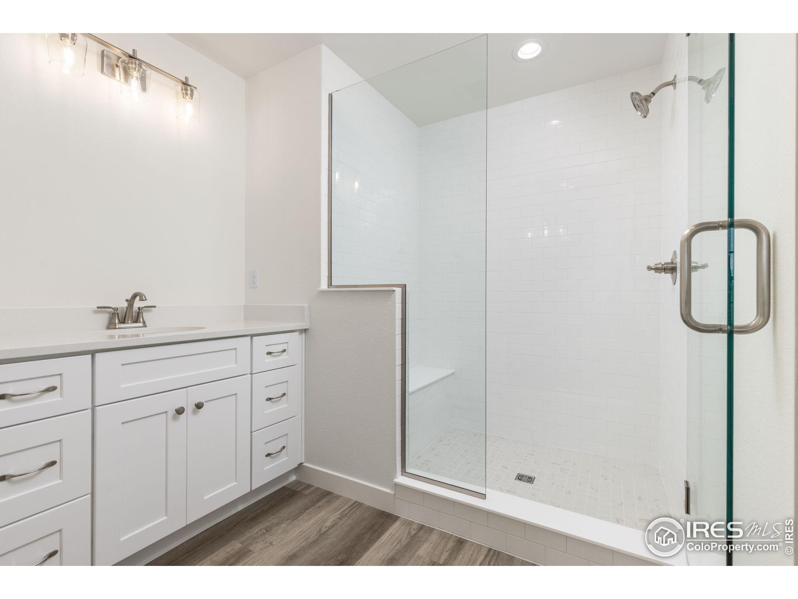 161 Washington Street Erie, CO 80516 - Photo 11 of 19 a bathroom with a shower and a sink