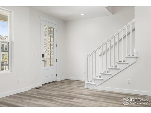 a view of entryway with wooden floor
