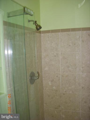 8518 Stevenswood Road Windsor Mill, MD 21244 - Photo 6 of 10 a bathroom with a shower