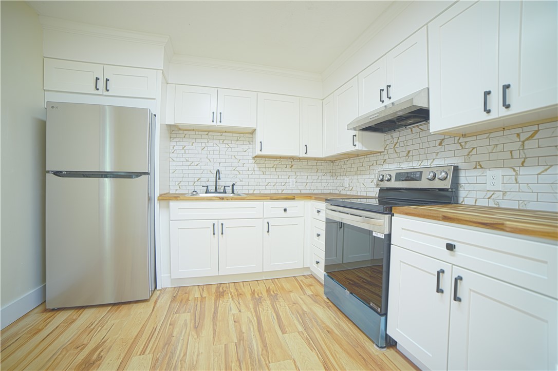 218 Thomas Heights Circle Seneca, SC 29678 - Photo 7 of 27 ALL NEW! Stainless appliances. Butcher block counters, backsplash, gentle close cabinetry.