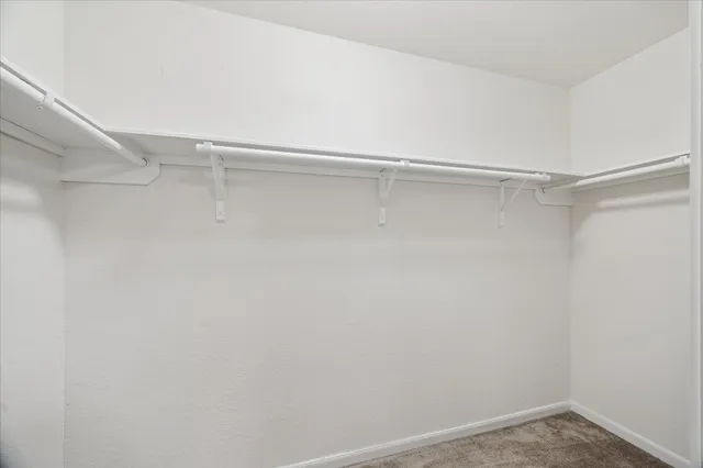 a view of an empty walk in closet