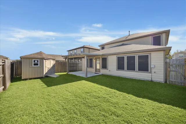 a view of a yard in front of a house