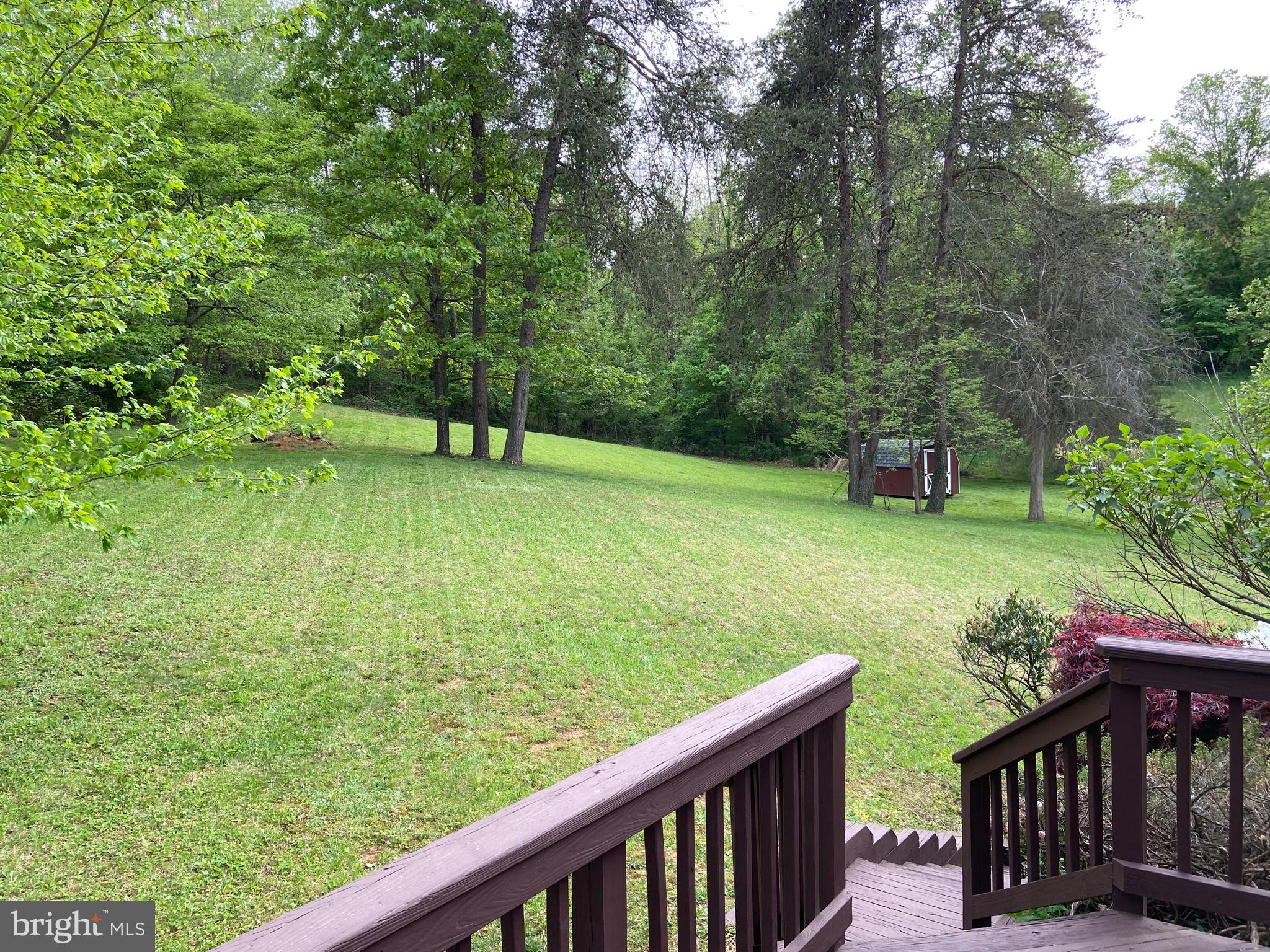 6232 Ridge Lane Warrenton, VA 20187 - Photo 14 of 20 View of back lawn & mature trees from 32 X 12 deck