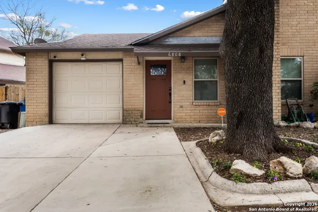 a front view of a house with a garage