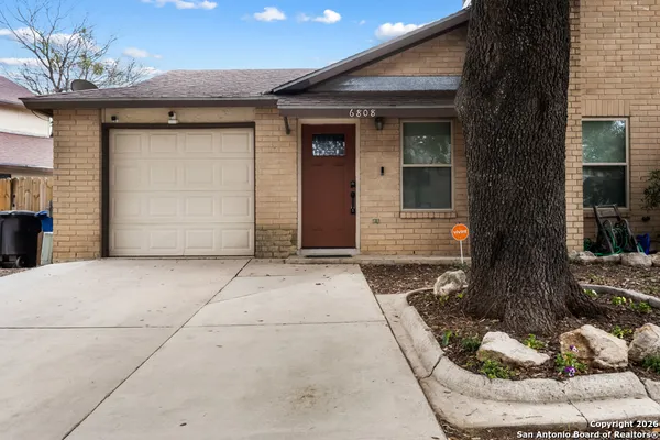 a front view of a house with a garage