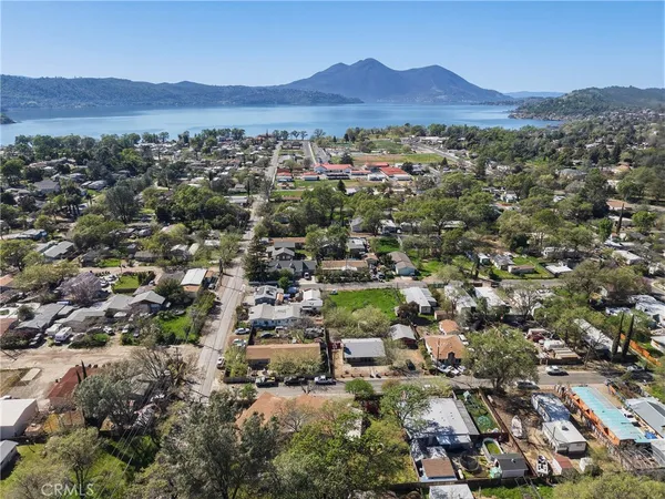 an aerial view of residential house and sandy dunes