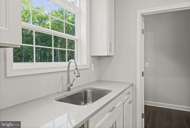 a kitchen with a sink and a window