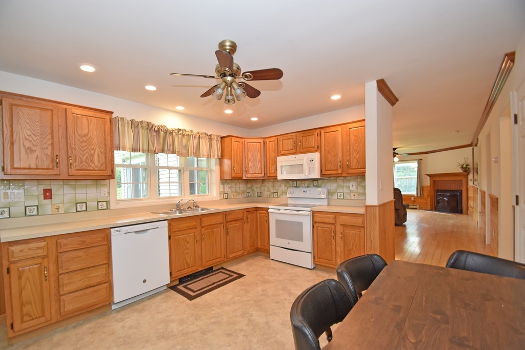 16 Farm Pond Road Oakham, MA 01068 - Photo 3 of 21 a kitchen with stainless steel appliances granite countertop a sink dishwasher stove and refrigerator