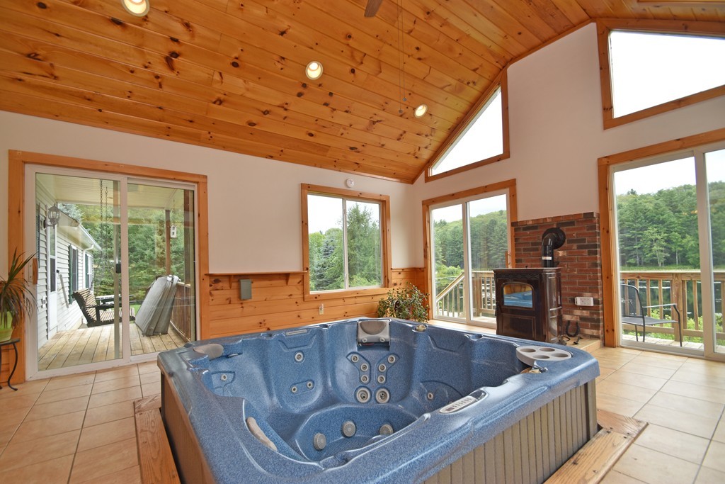 16 Farm Pond Road Oakham, MA 01068 - Photo 8 of 21 a living room with furniture and large windows
